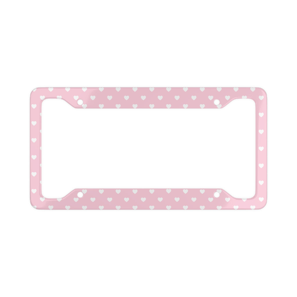Pink aluminum license plate frame with white heart polka dot pattern, front view on white background