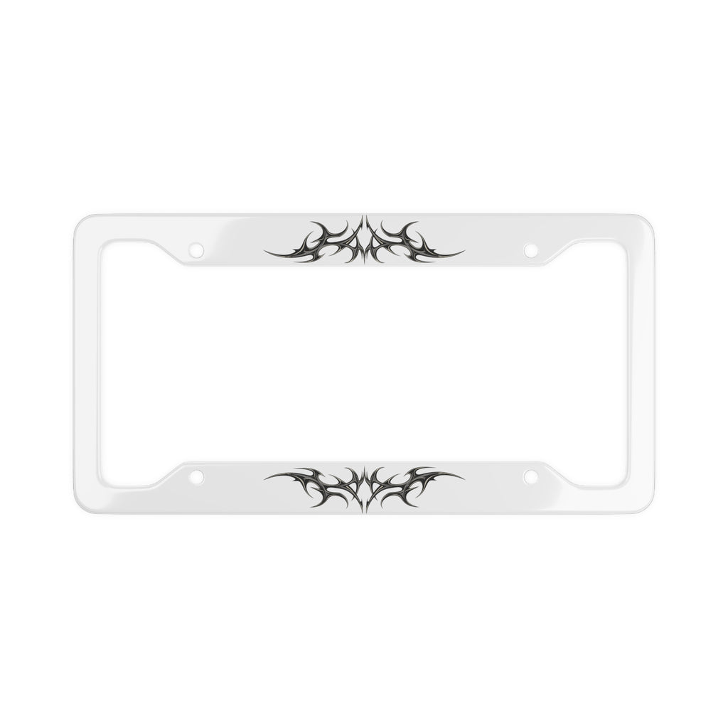 A white license plate frame with black cybersigilism graphic designs on the top and bottom edges, shown against a plain white background.