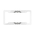 A white license plate frame with black cybersigilism graphic designs on the top and bottom edges, shown against a plain white background.