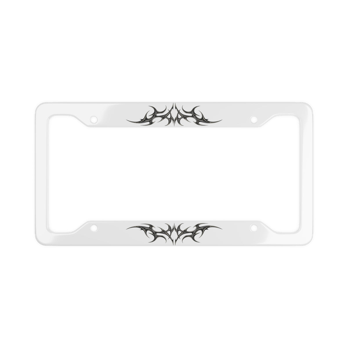 A white license plate frame with black cybersigilism graphic designs on the top and bottom edges, shown against a plain white background.