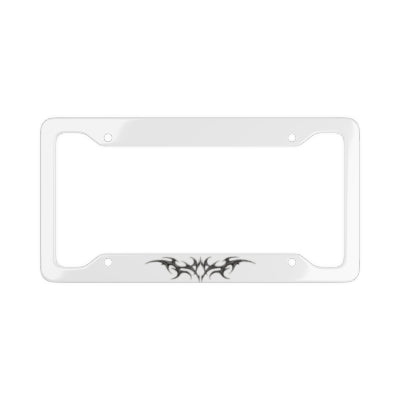 A white license plate frame with black cybersigilism graphic designs on the bottom edges, shown against a plain white background.